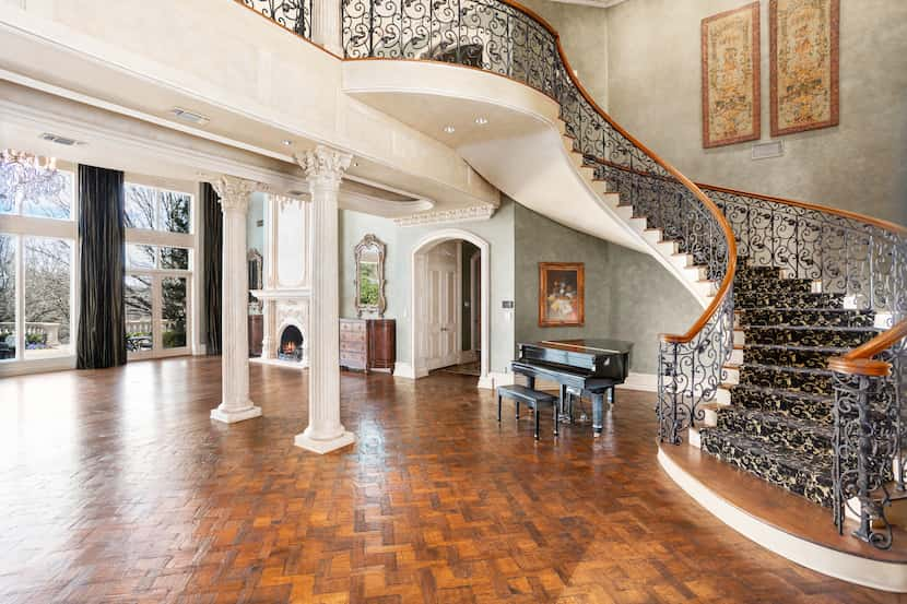 A spiral staircase leads family and guests to three bedrooms on the second floor.