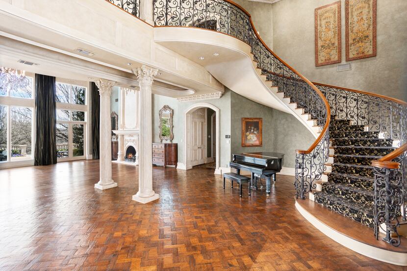 A spiral staircase leads family and guests to three bedrooms on the second floor.