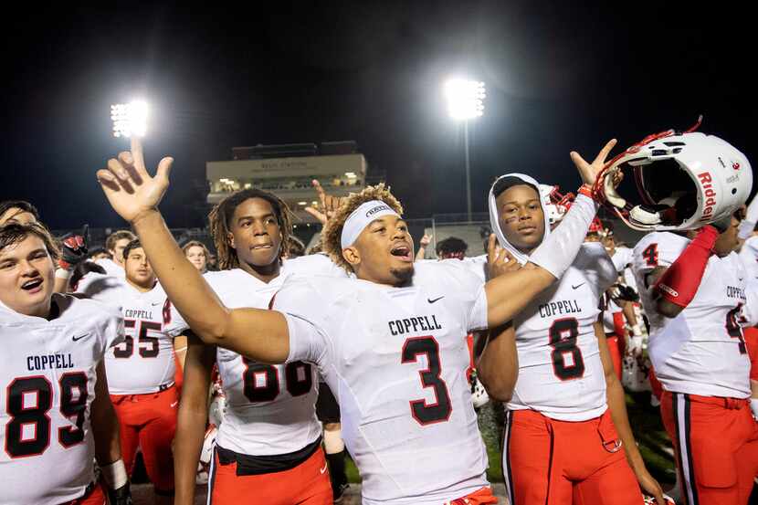 Coppell senior defensive back Jonathan McGill (3) celebrates with teammates after defeating...