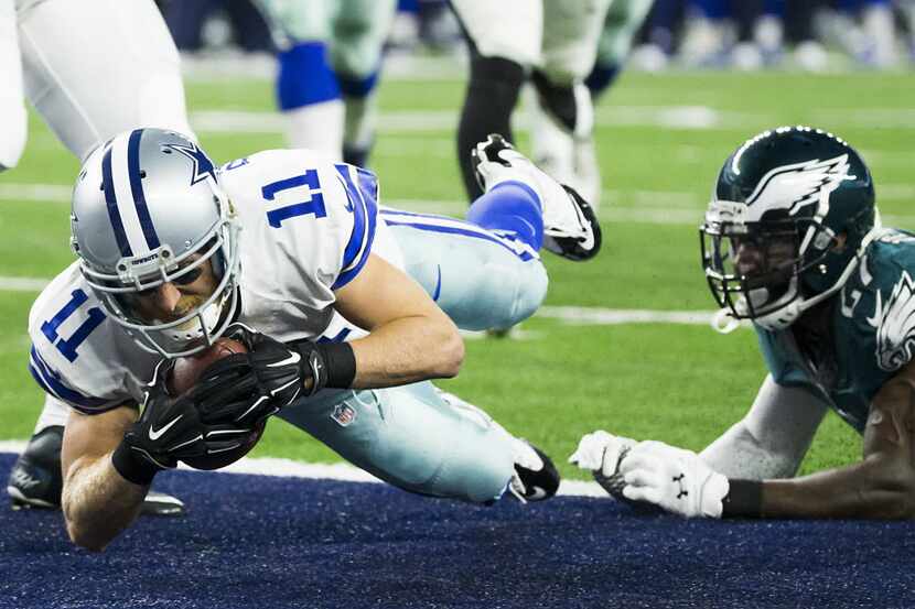 Dallas Cowboys wide receiver Cole Beasley (11) scores on a 5-yard touchdown reception during...