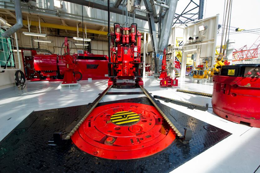 The Iron Roughneck, made by National Oilwell Varco Inc., automates the task of connecting...