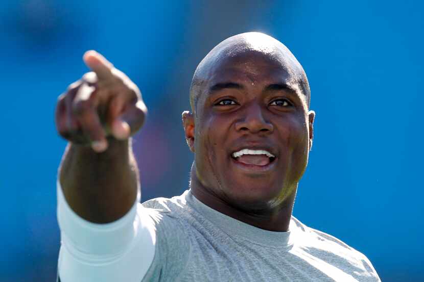 Dallas Cowboys outside linebacker DeMarcus Ware (94) waves to Cowboys fans prior to their...