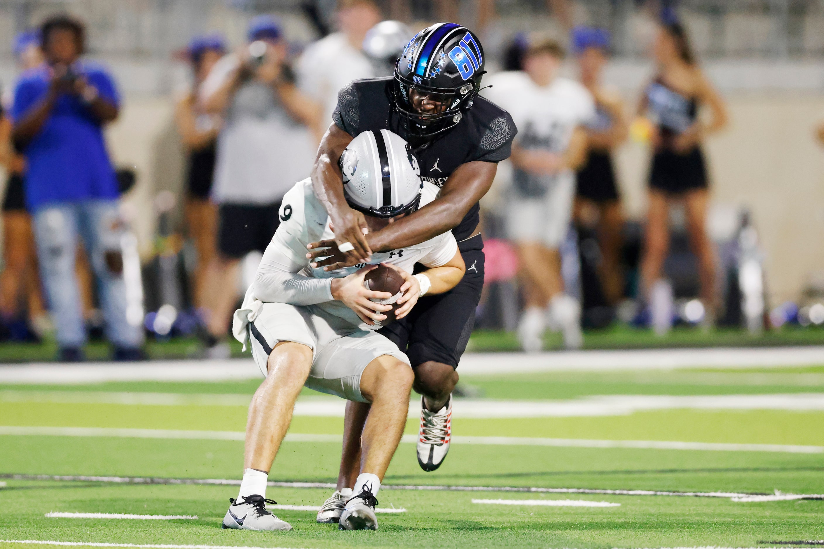 North Crowley linebacker Neutae Cassey (44) sacks Denton Guyer quarterback Kevin Sperry (9)...