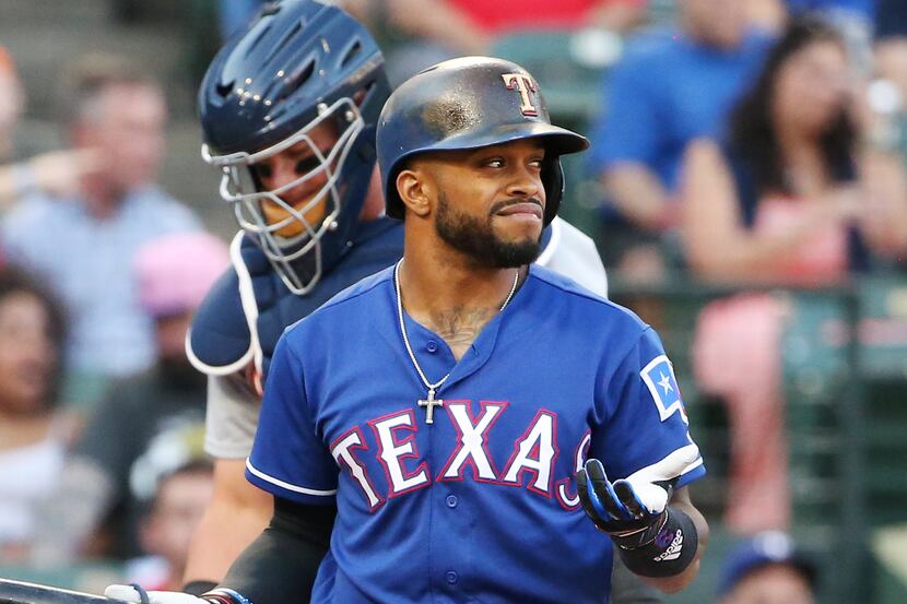 Texas Rangers left fielder Delino DeShields (3) reacts after being called out on strikes...