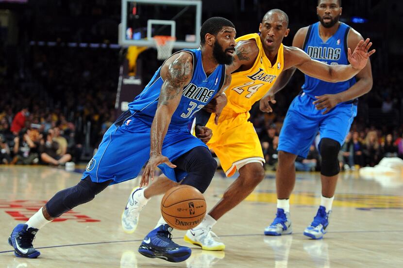 Los Angeles Lakers shooting guard Kobe Bryant (24) guards Dallas Mavericks shooting guard...