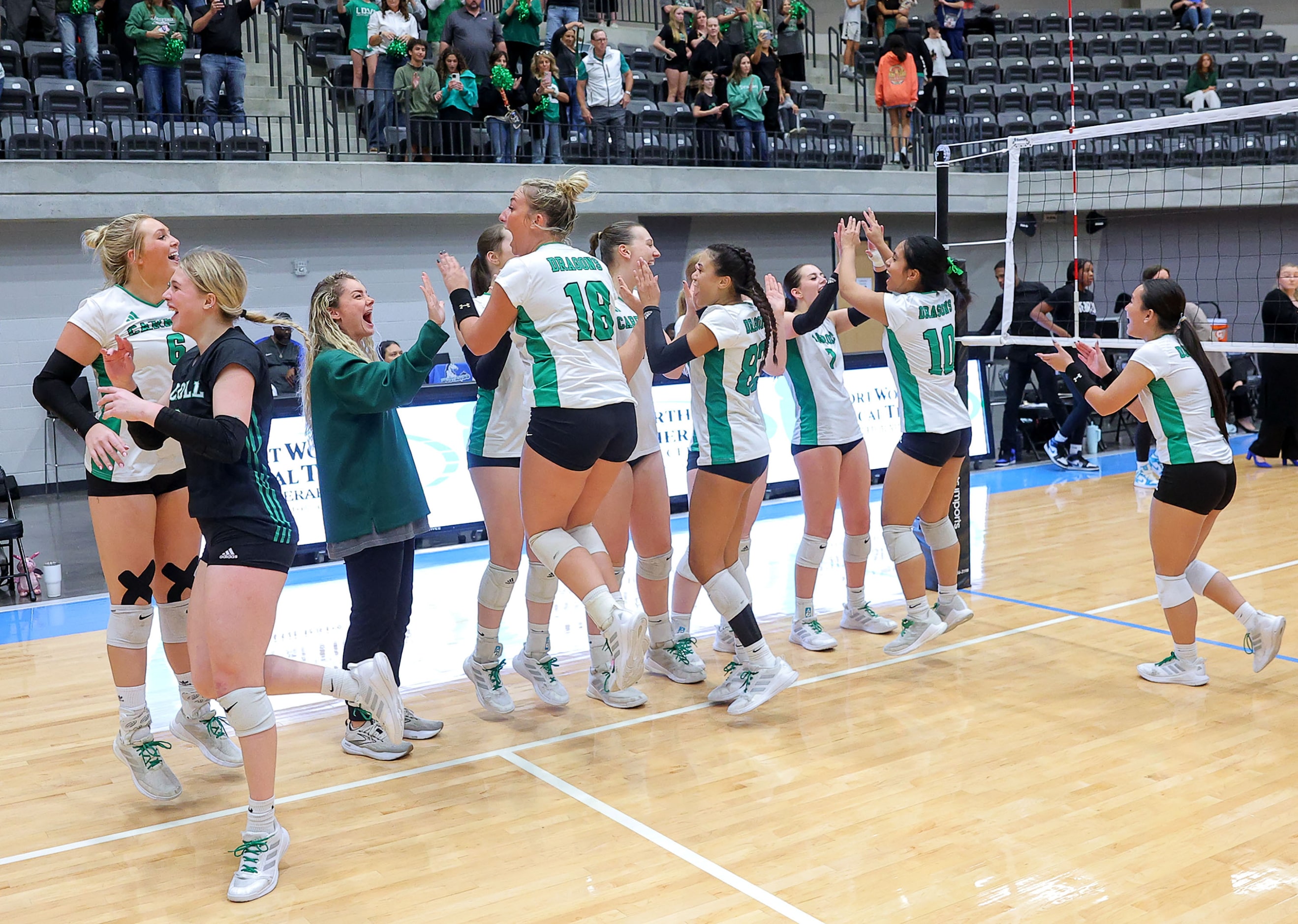 The Southlake Carroll Lady Dragons celebrate their victory over Hebron, 3-0 in the Class 6A...