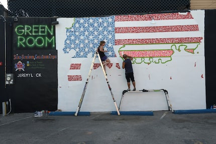 The mural, completed outside the Green Room pub, was donated as part of a 10-mural project...