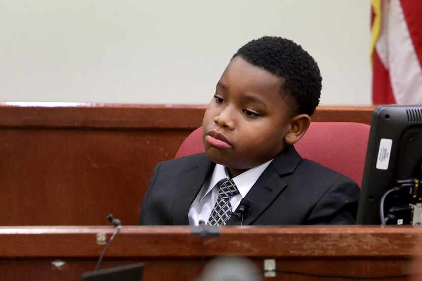 Zion Carr, 11, appeared upbeat before his testimony. But as proceedings wore on during the...