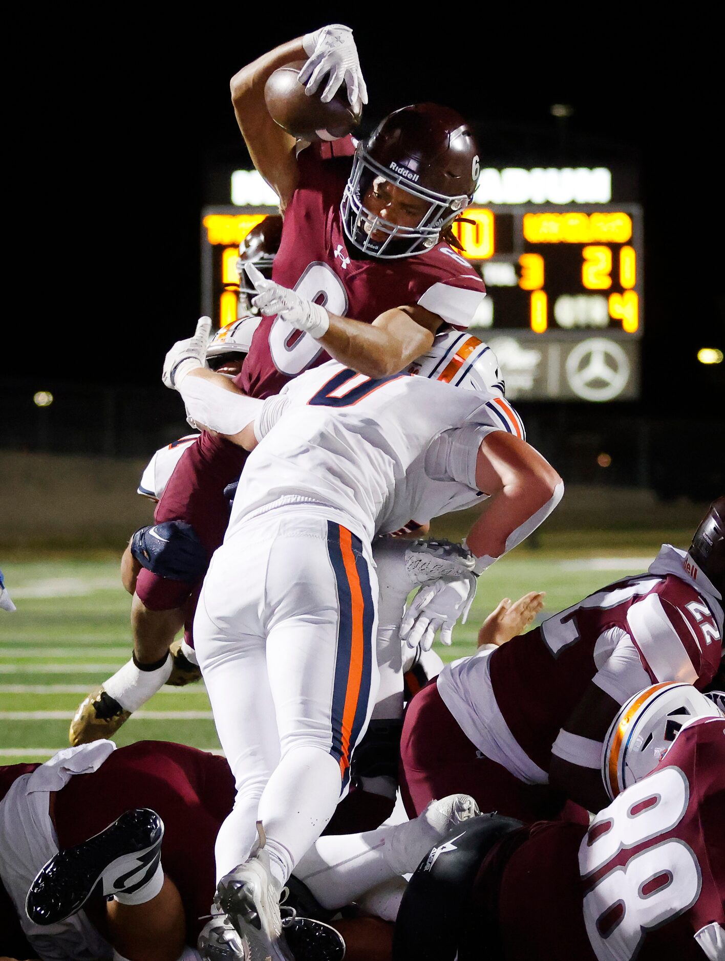 Mansfield Timberview running back Jaylon Woods (6) got over the top for a fourth quarter...