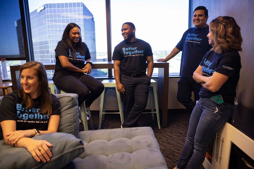 Employees chat at the Beaird Harris office in Dallas.