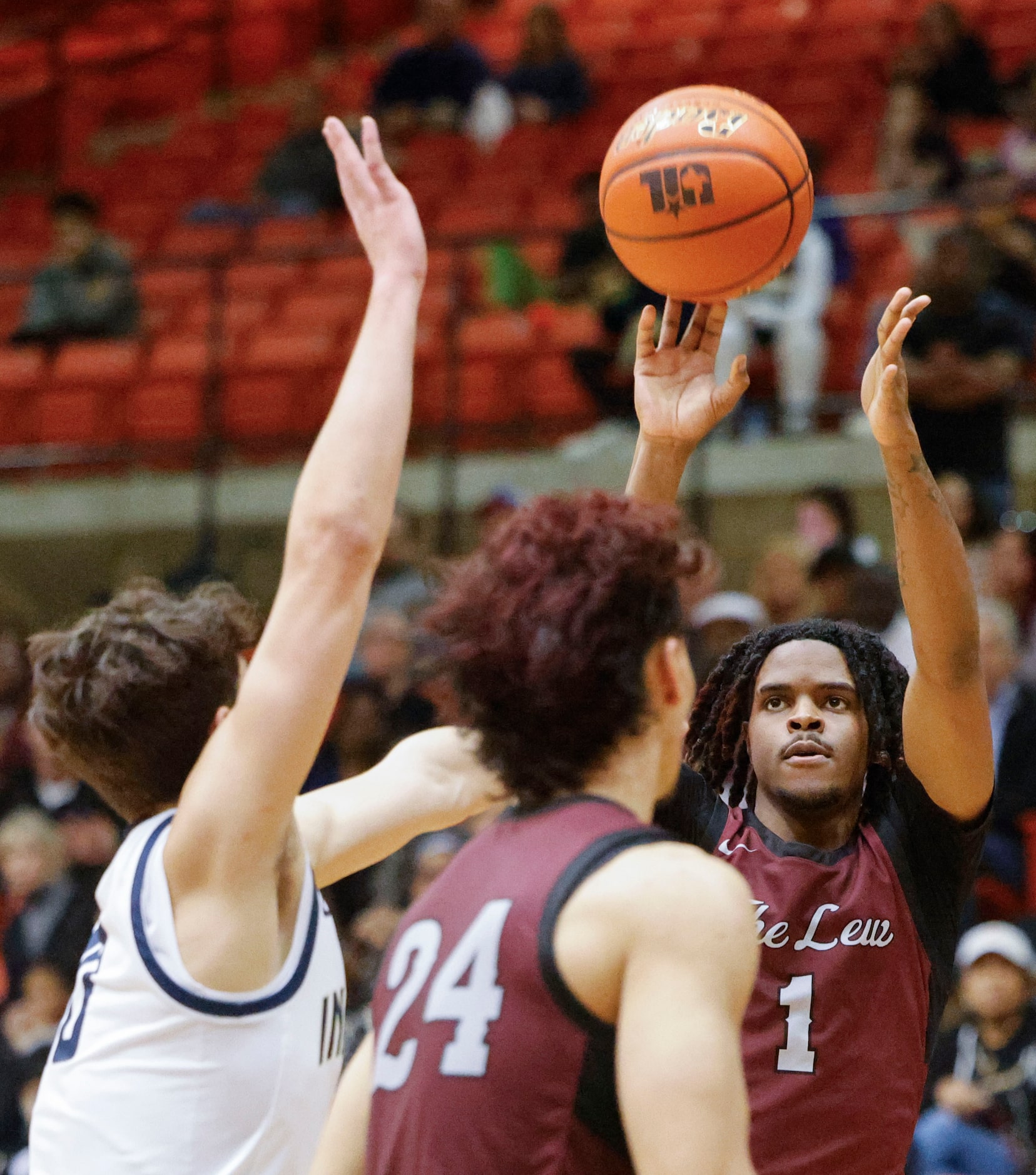 Lewisville High’s Landon Brown (1) shoots a three-pointer against Keller high during the...