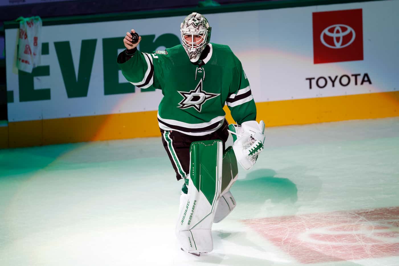 Dallas Stars goaltender Jake Oettinger (29) waves to the crowd after being recognized as a...