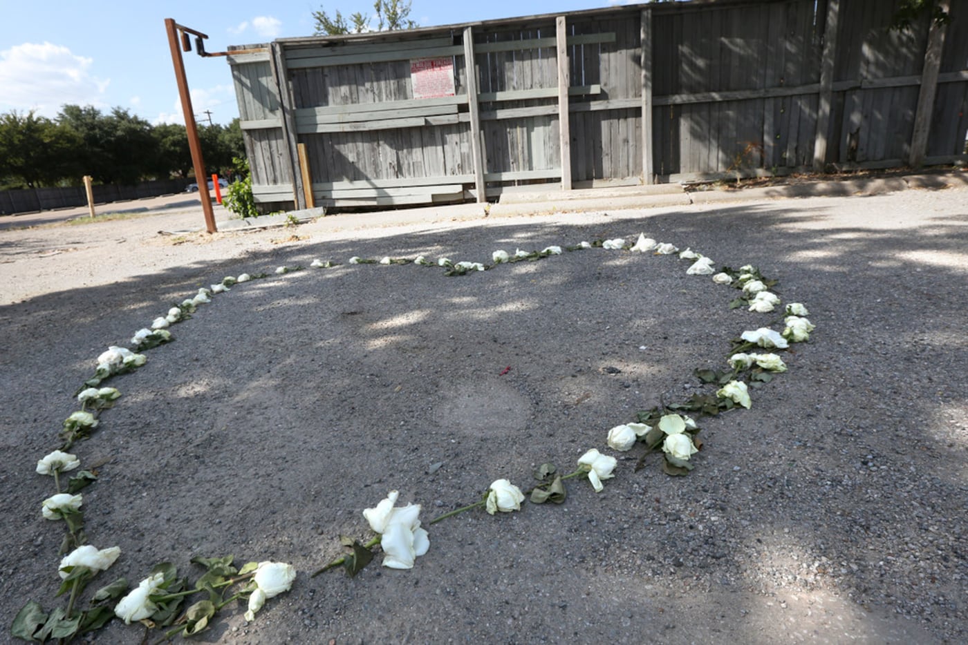 A garland of roses marks the spot where Sara Hudson was killed a few blocks west of...