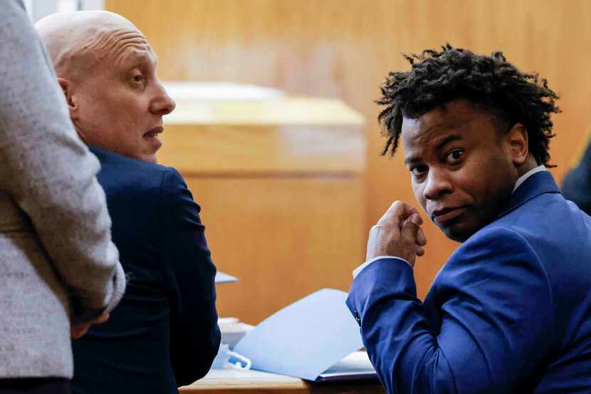 Darius Fields, right, accompanied by his lawyer Michael Levine looks back during his court...