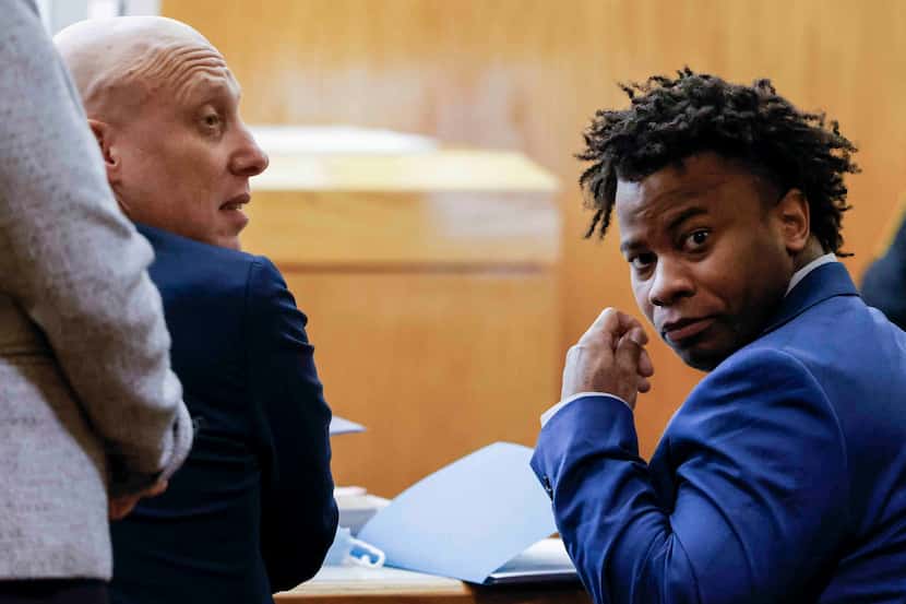 Darius Fields, right, accompanied by his lawyer Michael Levine looks back during his court...