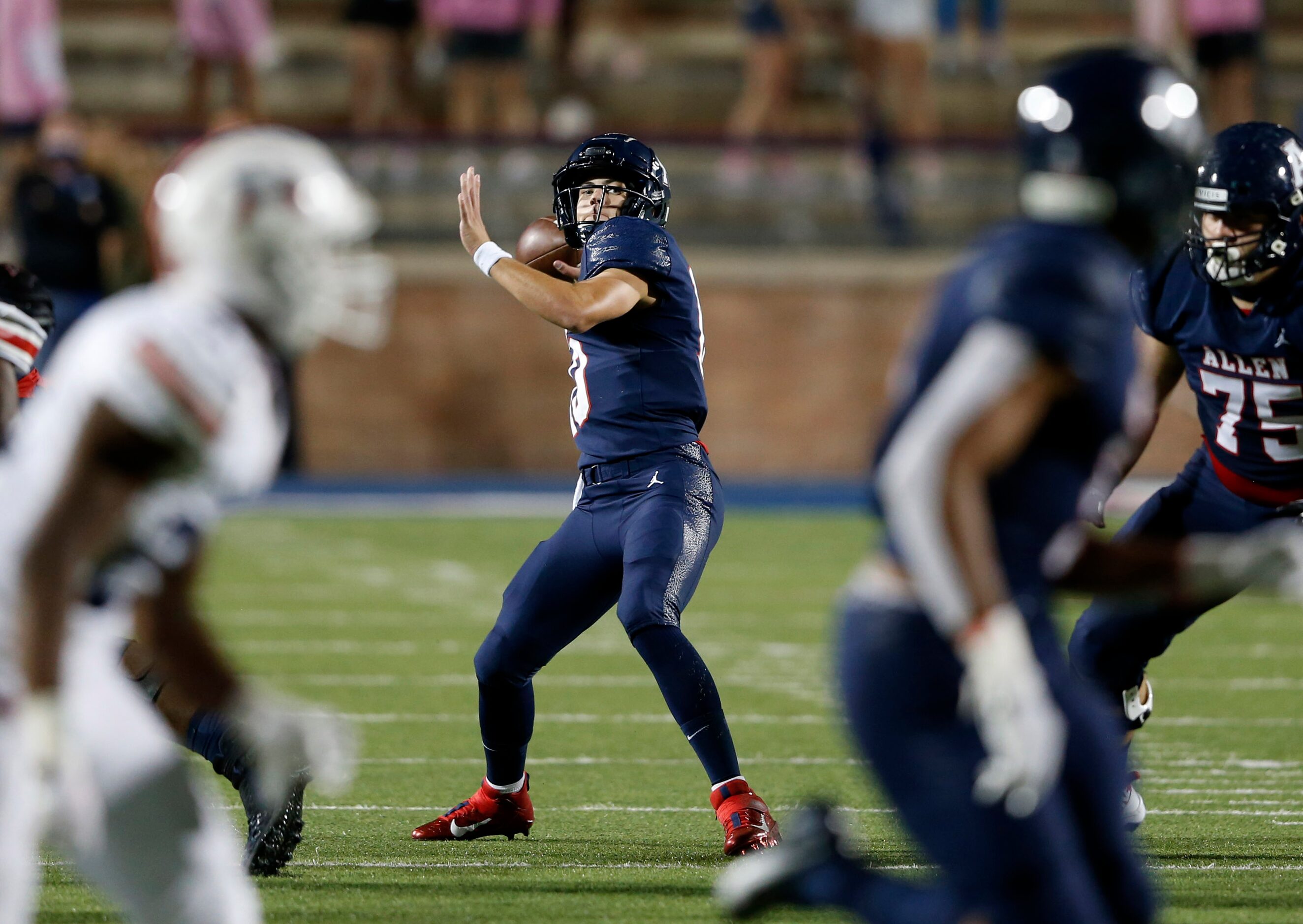 Allen's General Booty (10) gears up to pass the ball to Bryson Green (9) in a game against...