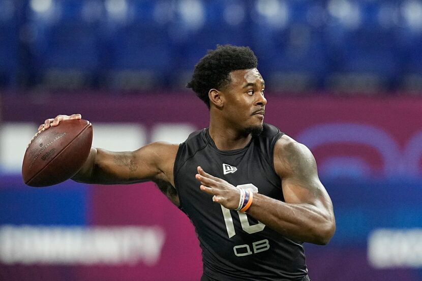 Liberty quarterback Malik Willis runs a drill during the NFL football scouting combine,...