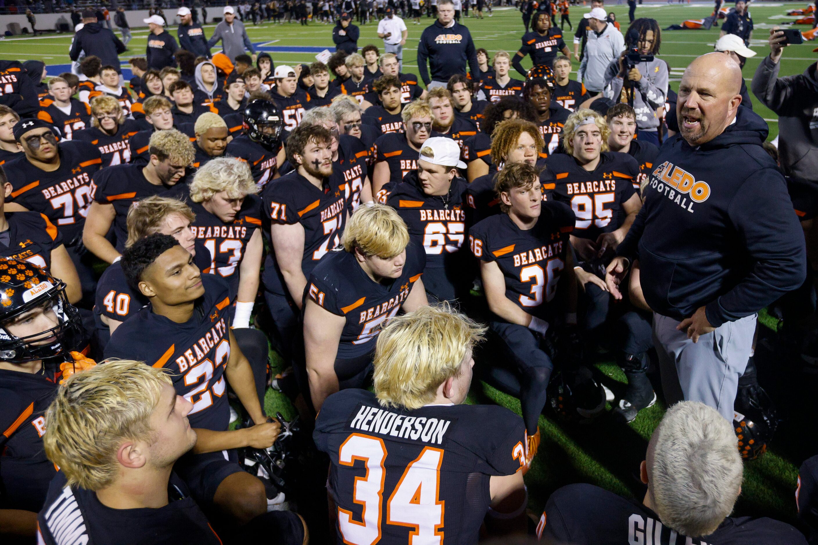 Aledo head coach Robby Jones speaks to his team after winning a Class 5A Division I state...