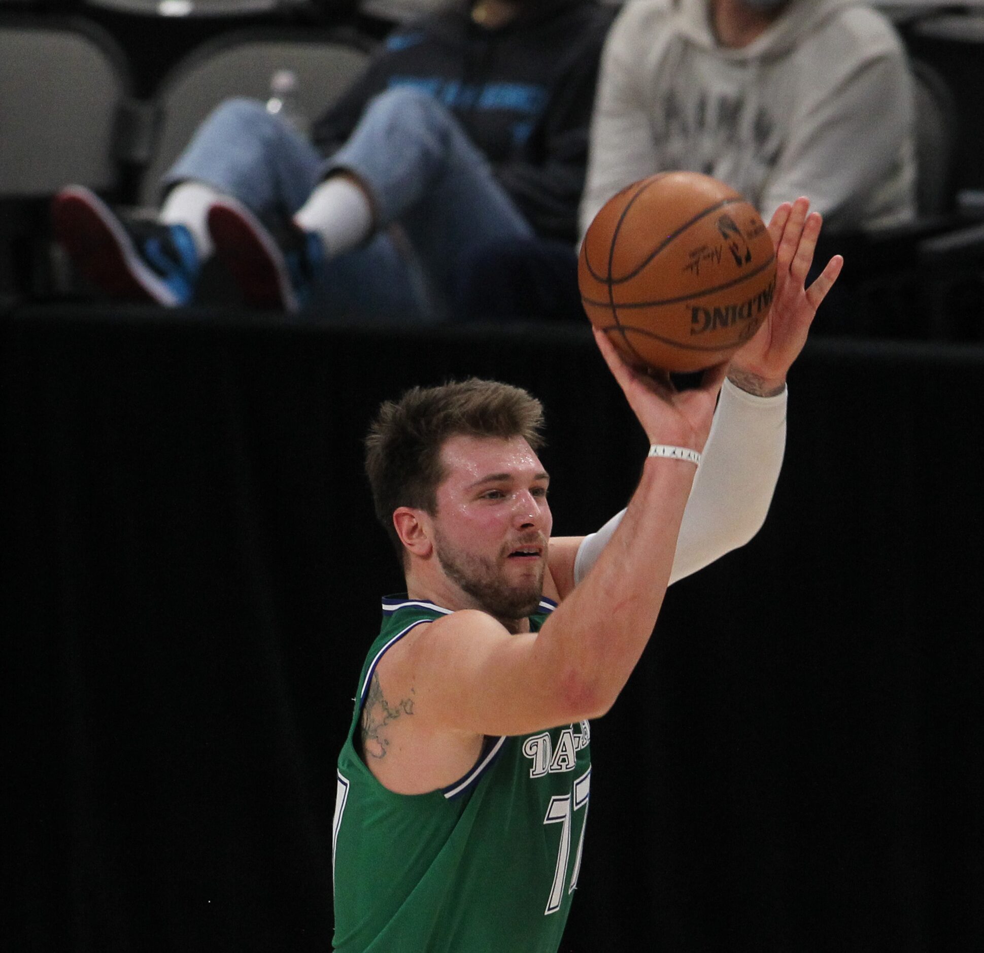 Dallas Mavericks guard Luka Doncic (77) sinks a 3-pointer during 2nd quarter action against...