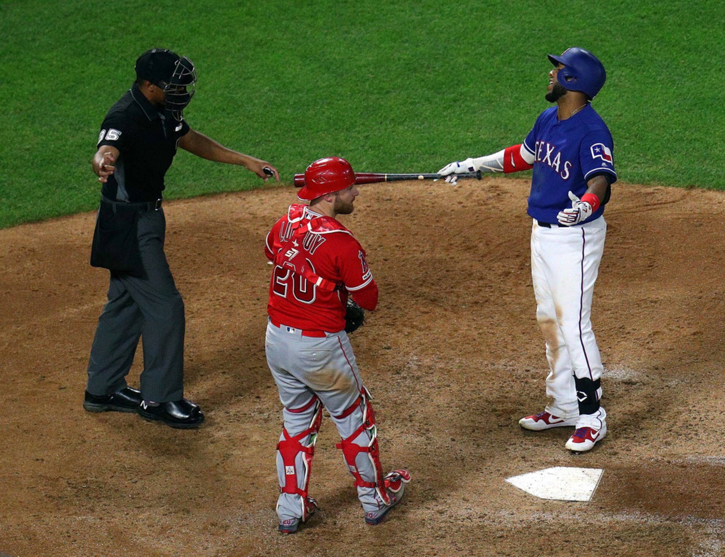 ARLINGTON, TEXAS - APRIL 17: Elvis Andrus #1 of the Texas Rangers reacts after striking out...