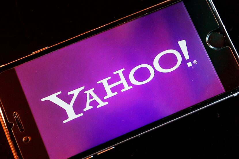 In this Dec. 15, 2016, file photo, the logo of Yahoo appears on a smartphone in Frankfurt,...