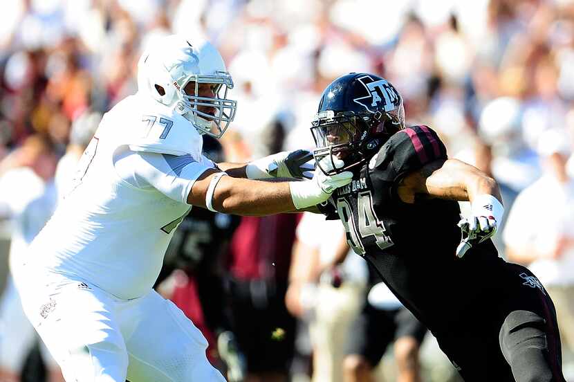 STARKVILLE, MS - NOVEMBER 03:  Damontre Moore #94 of the Texas A&M Aggies rushes against...