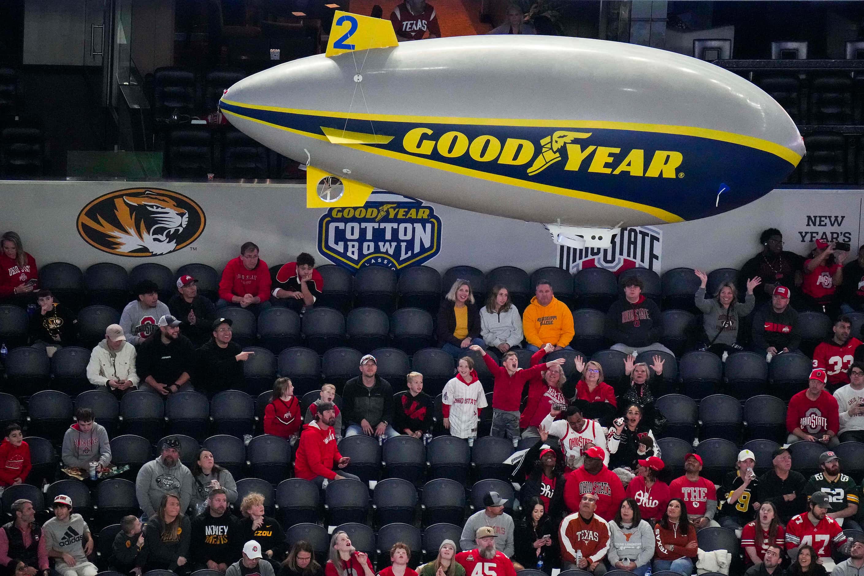 A miniature Goodyear Blimp flies around the stadium before the Goodyear Cotton Bowl Classic...