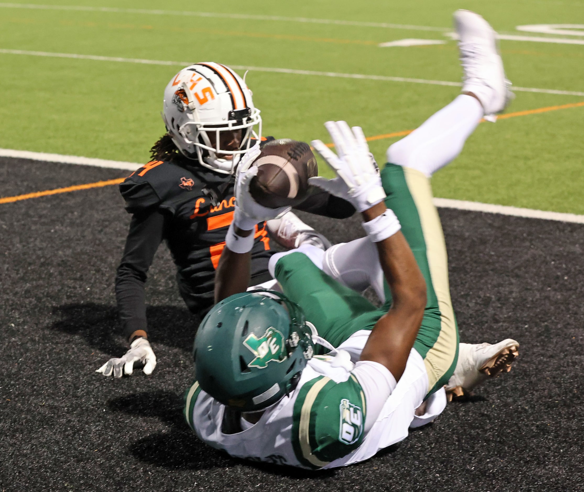 DeSoto High receiver Ethan Feaster (7) catches a touchdown pass during the first half of a...