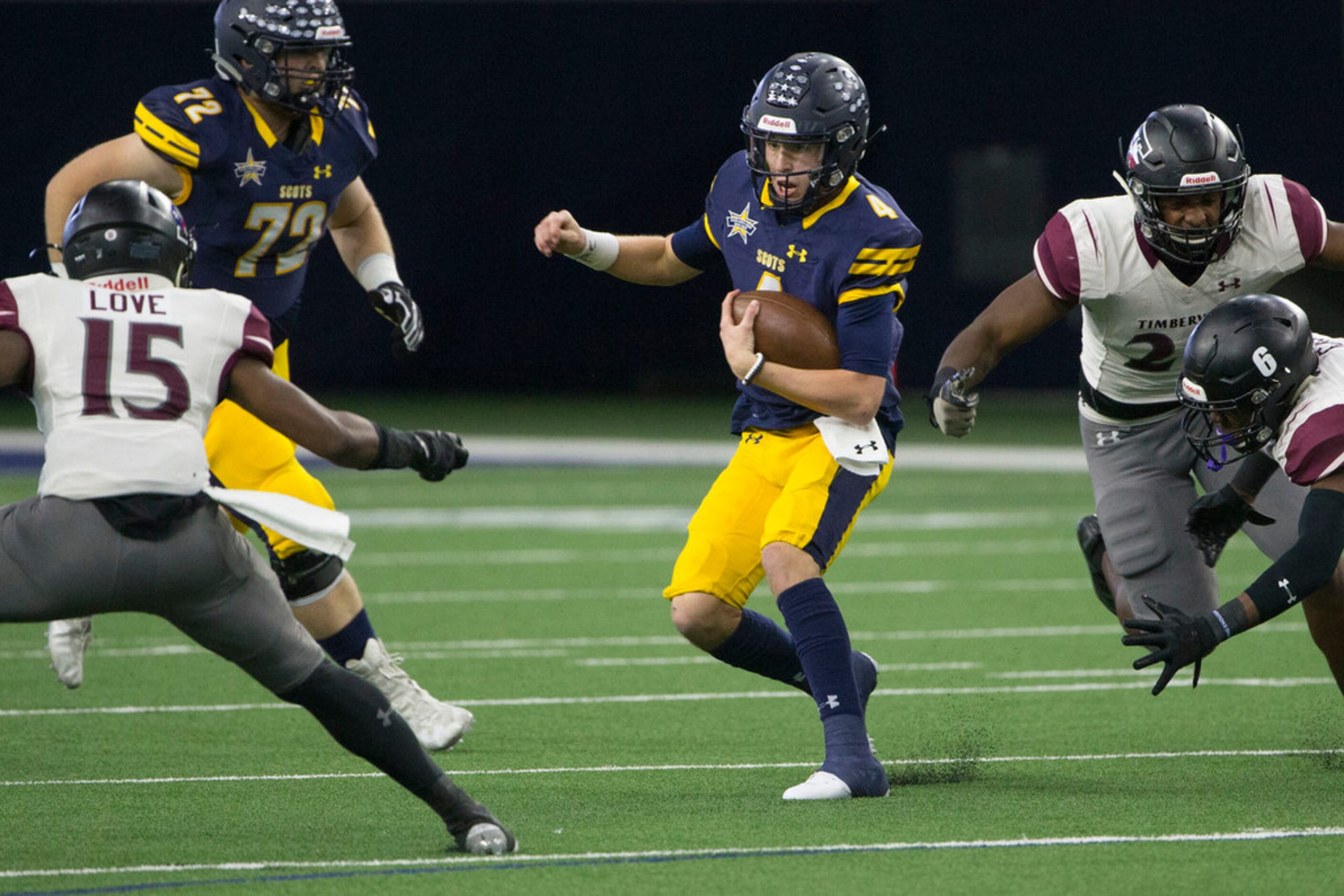 Highland Park quarterback Chandler Moore (4) makes his way through a hole in Timberview's...