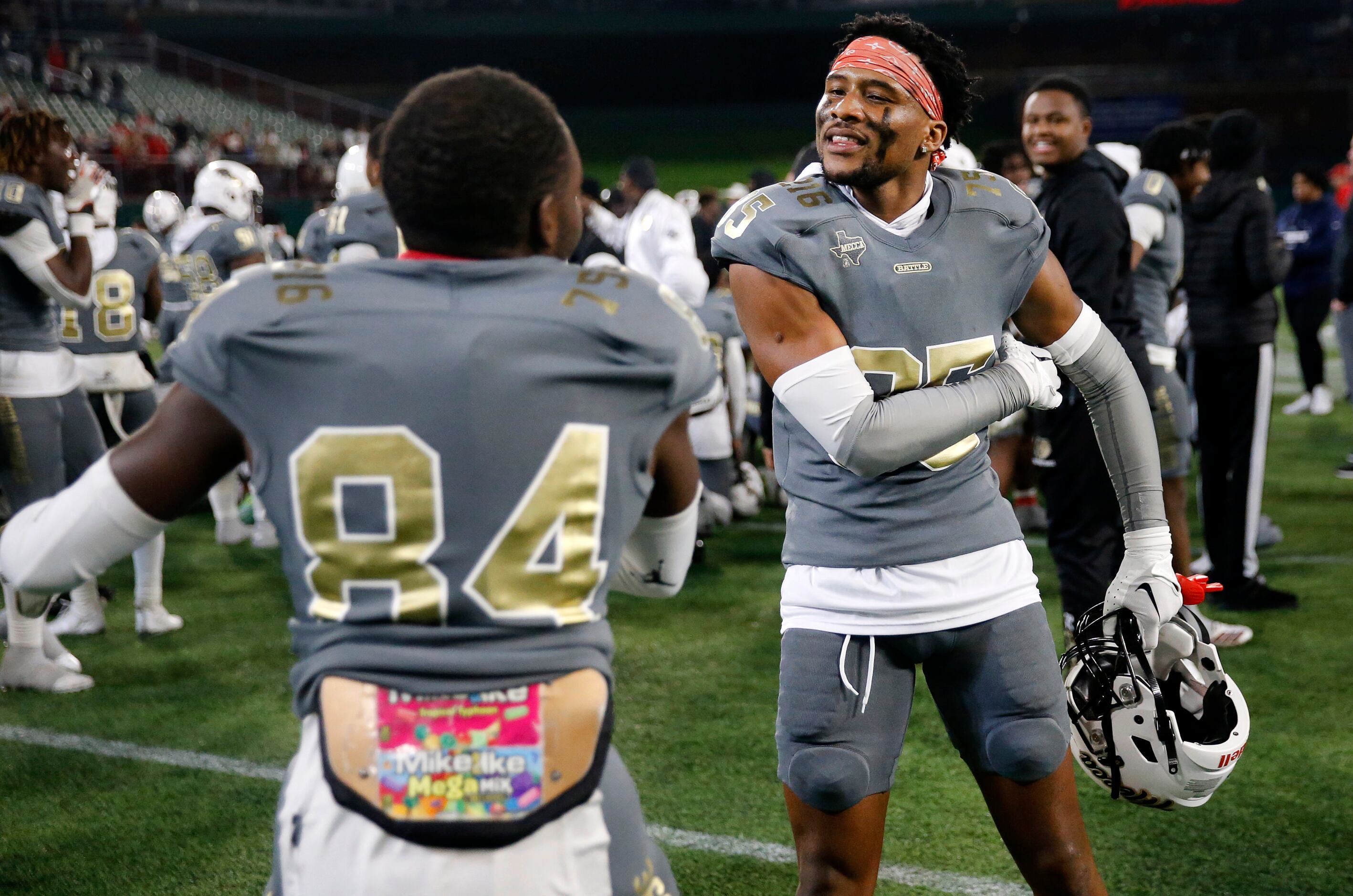 South Oak Cliff football players Joshua Manley (right) and Jordan Mayes (84) celebrate their...