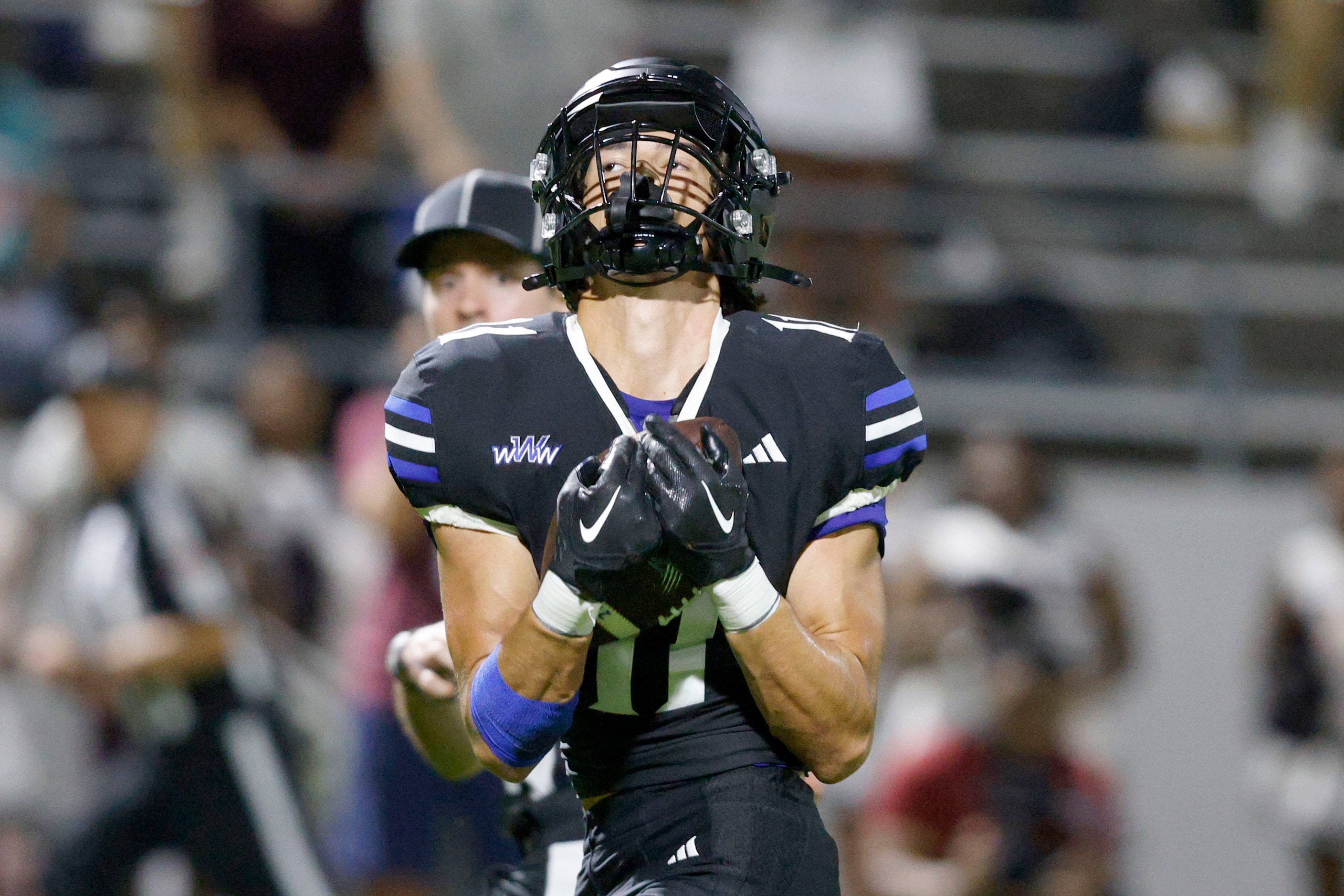 Byron Nelson's Leo Almanza (11) catches the pass and scores against Lewisville during the...