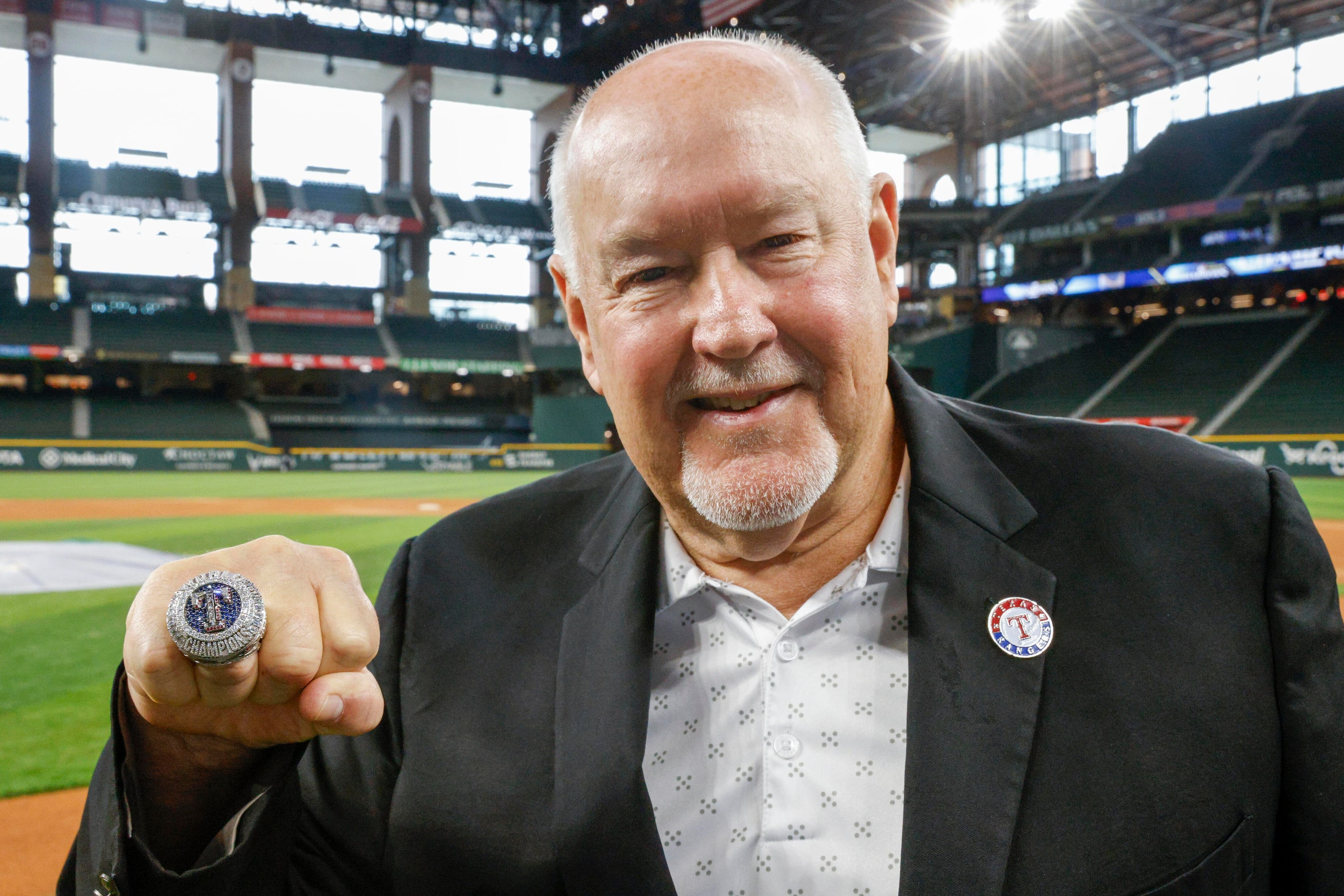 Chuck Morgan, Texas Rangers public address announcer, poses with his World Series...