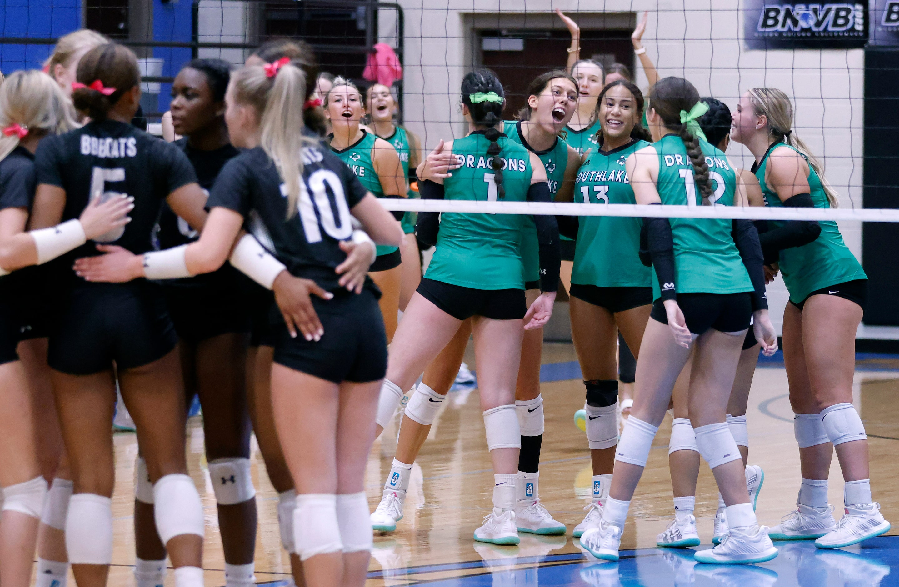 Southlake Carroll players celebrate a point over Trophy Club Byron Nelson during their...