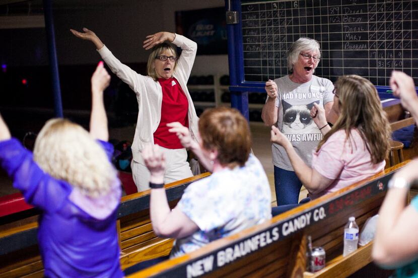 Teams take a dance break to sing along during a game of ninepin cosmic bowling at Solms...