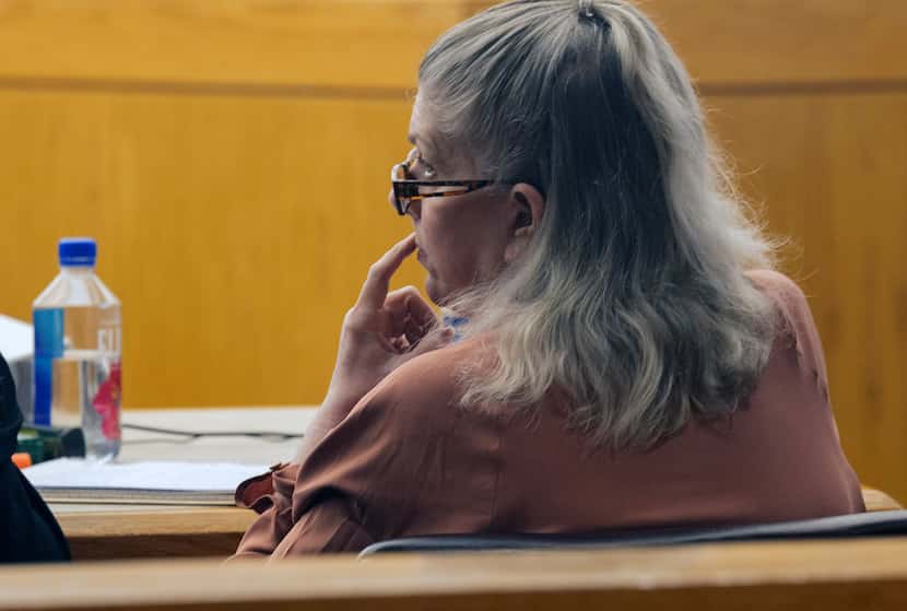 Lisa Dykes listens as Charles Beltran, Dykes' boyfriend and one of the individuals facing...