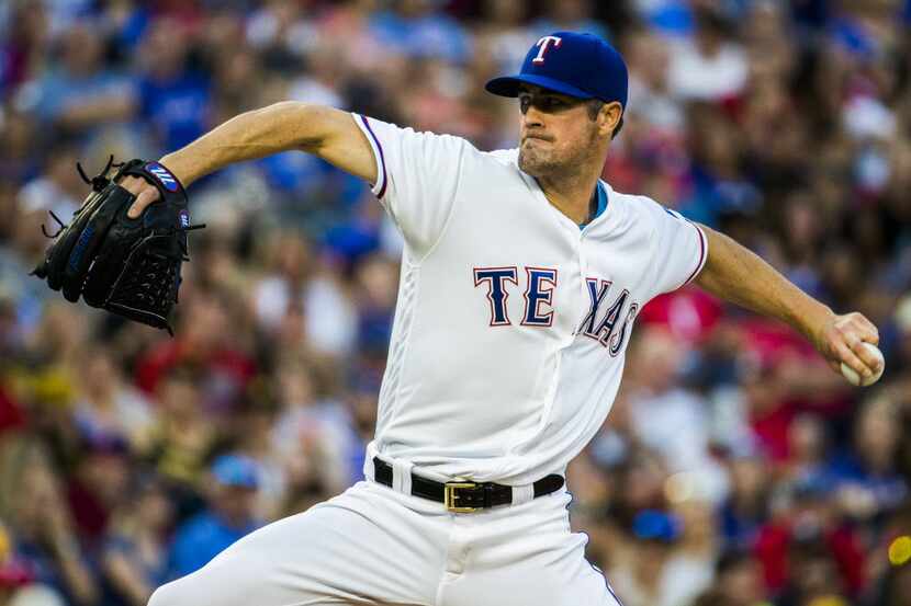 Texas Rangers starting pitcher Cole Hamels (35) pitches during the third inning of their...