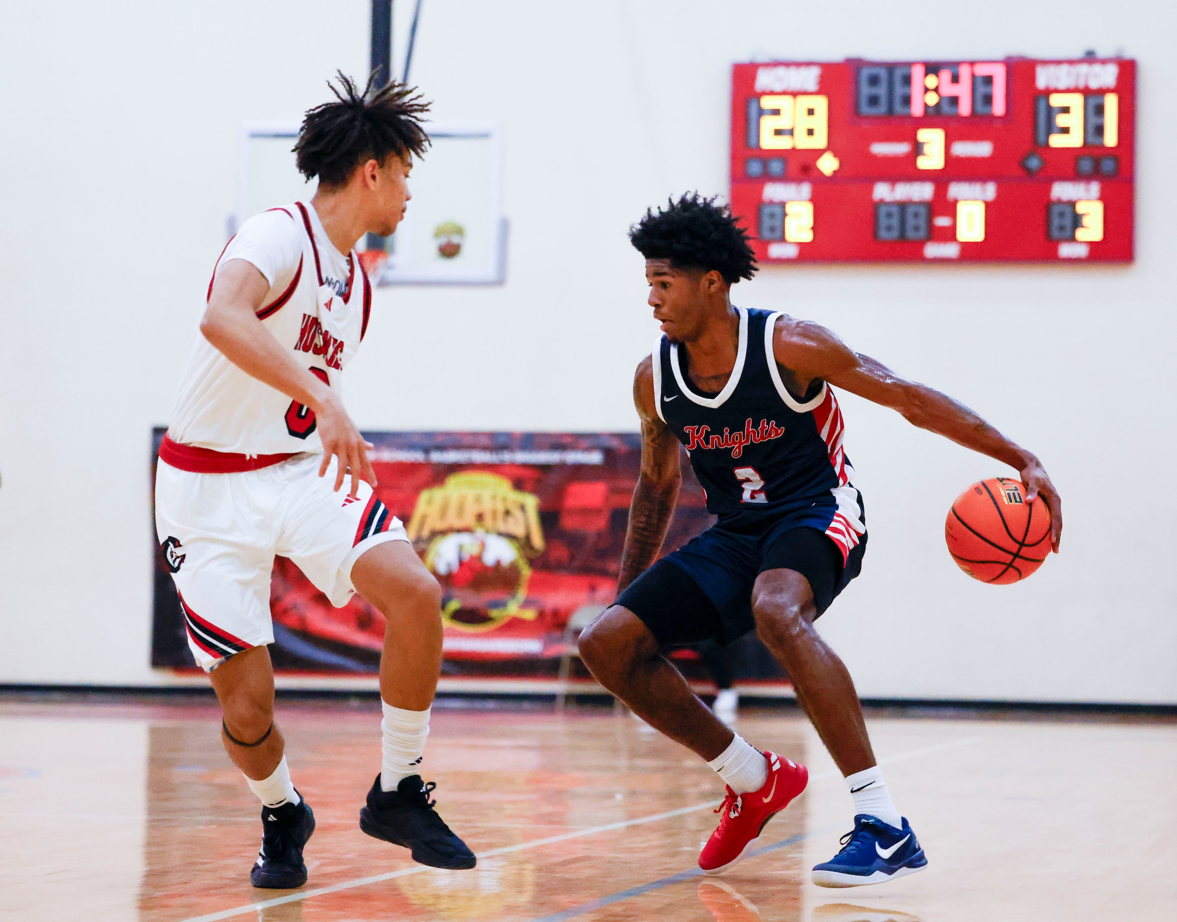 Kimball High’s Jaylon Dean-Vines (2) dribbles against Kai Patton of Centennial High of...