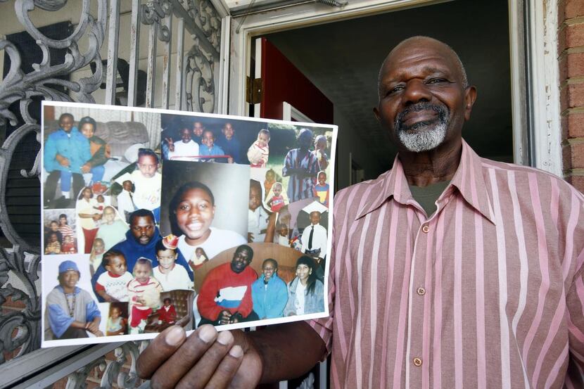 
Kenneth Evans of Temple Hills, Md., holds photos of his son Tuan Evans, who is scheduled...