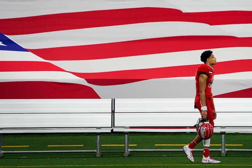 A dejected Javien Clemmer, a Cedar Hill wide receiver walked off the field after the 51-14...