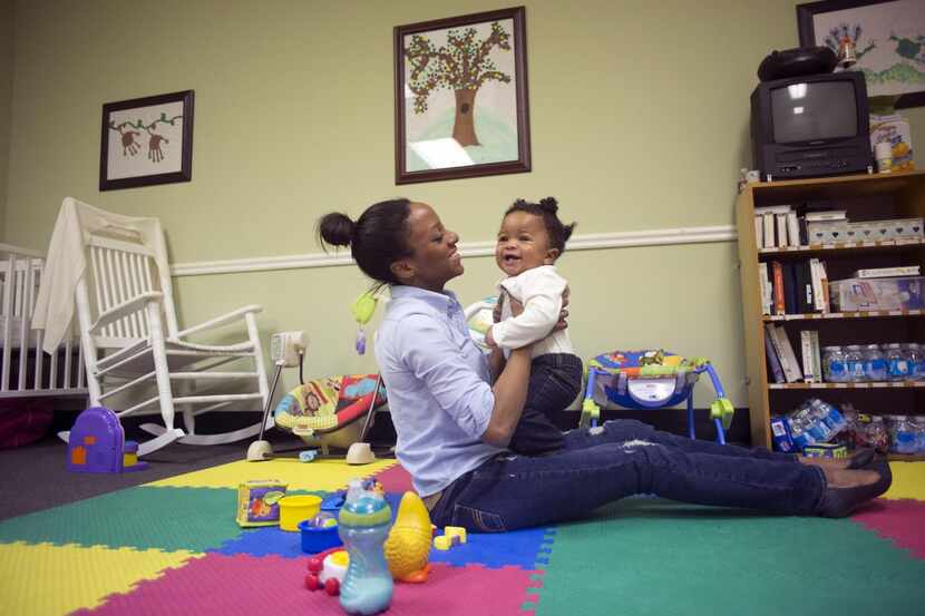 
Nasya Dotie plays with her son at a Care Net of Central Texas facility in Waco, Texas, in...