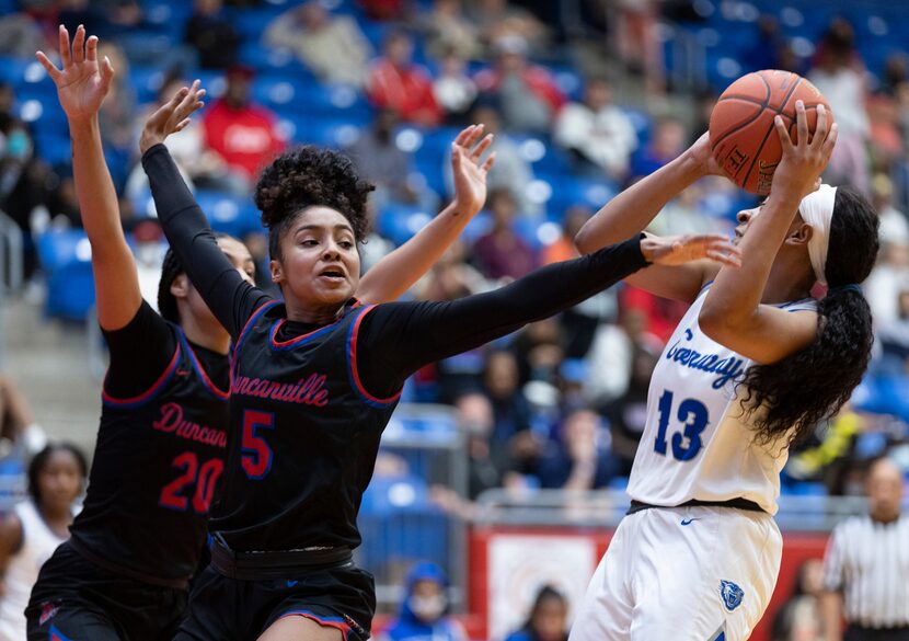 Conway junior guard Chloe Clardy (13) attempts a shot as Duncanville junior guard Victoria...