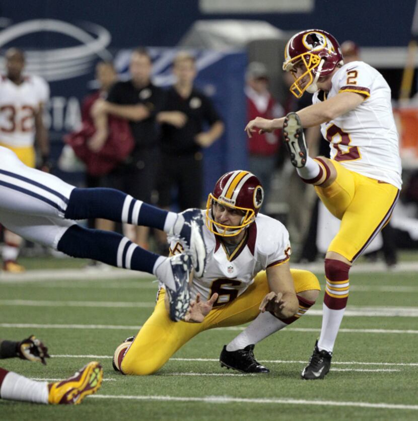Washington Redskins kicker Kai Forbath (2) kicks a field goal from the hold of Washington...