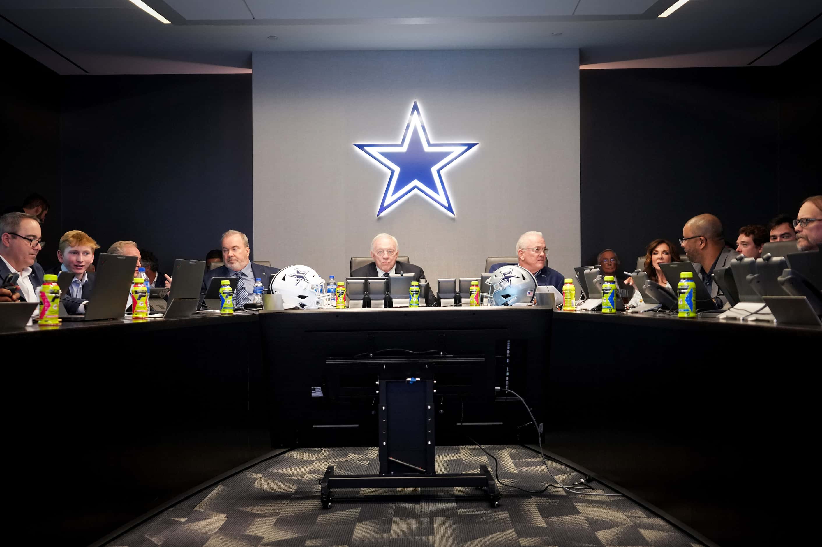 Dallas Cowboys owner and general manager Jerry Jones sits at the head of the table in the...