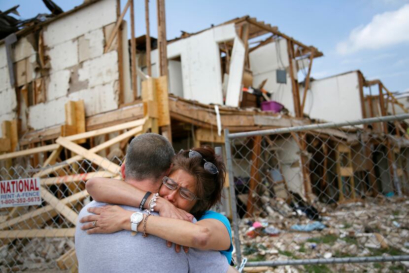 Shona Jupe, a resident of apartments destroyed in the West fertilizer plant explosion, hugs...