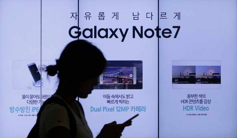 A woman walked by an advertisement of Samsung Electronics Galaxy Note 7 smartphone at the...