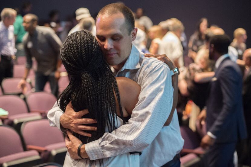 Will Richey hugs Noelle LeVeaux during a forum on race relations hosted by the Dallas...