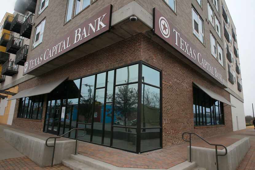 Texas Capital Bank reduced its workforce on Tuesday three weeks after calling off a merger...