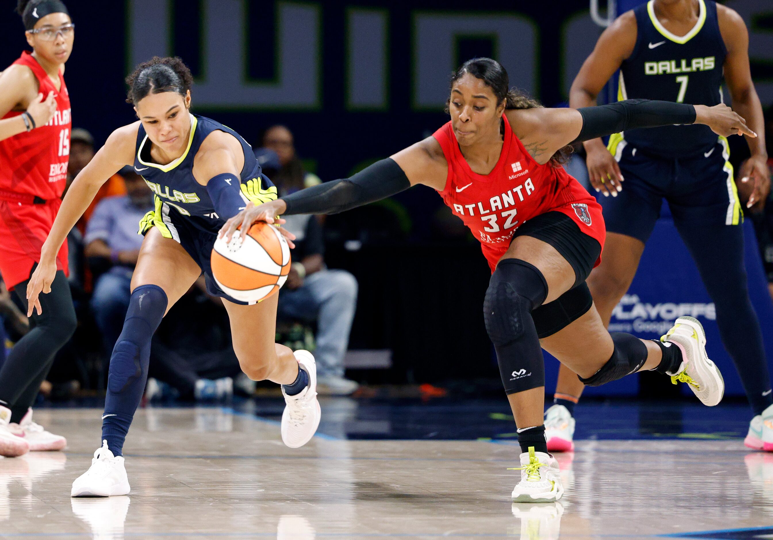 Dallas Wings forward Satou Sabally (0) and Atlanta Dream forward Cheyenne Parker (32) reach...