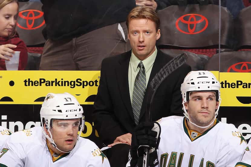 Head coach Glen Gulutzan (center) has guided to the Stars to a 14-9-1 record this season