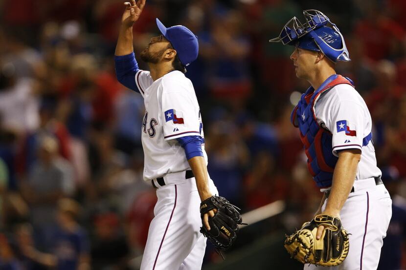 Texas Rangers relief pitcher Joakim Soria (28) celebrate the win as Texas Rangers catcher...